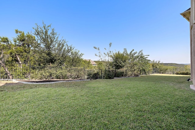 view of yard with a fenced backyard