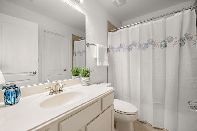 bathroom featuring visible vents, toilet, vanity, and tile patterned flooring