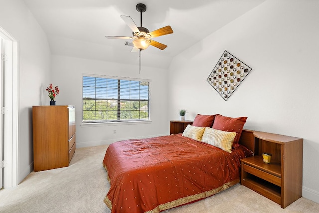 bedroom featuring vaulted ceiling, a ceiling fan, baseboards, and carpet floors