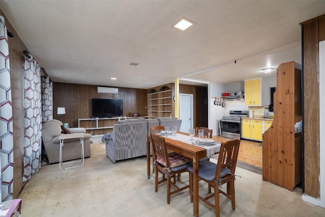 dining area with wooden walls and visible vents