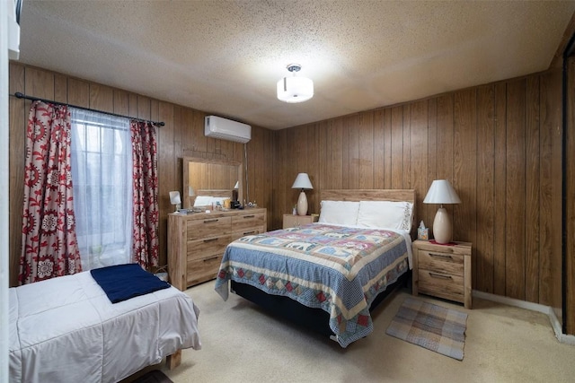 bedroom featuring light carpet, a textured ceiling, wood walls, and a wall mounted AC