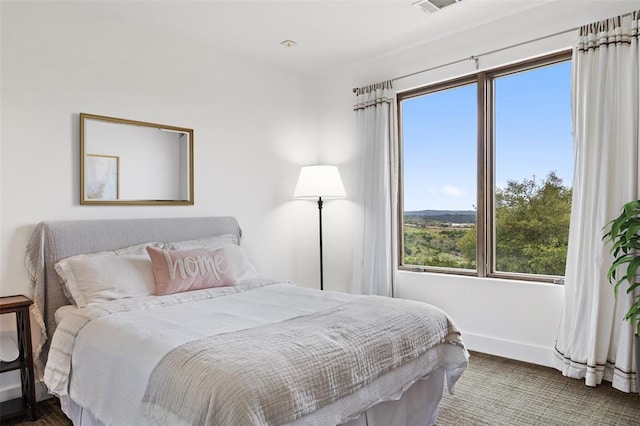 bedroom featuring baseboards