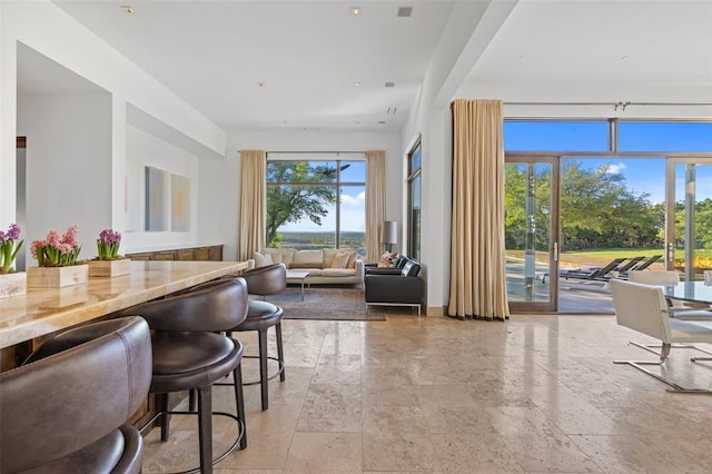 dining room with stone tile floors