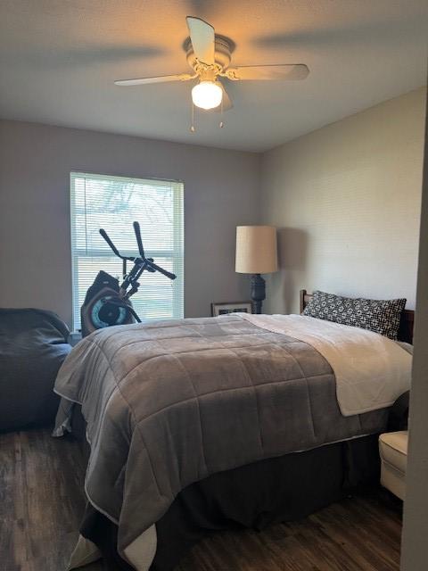 bedroom with wood finished floors and a ceiling fan