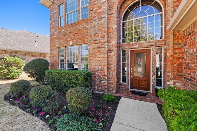 entrance to property with brick siding