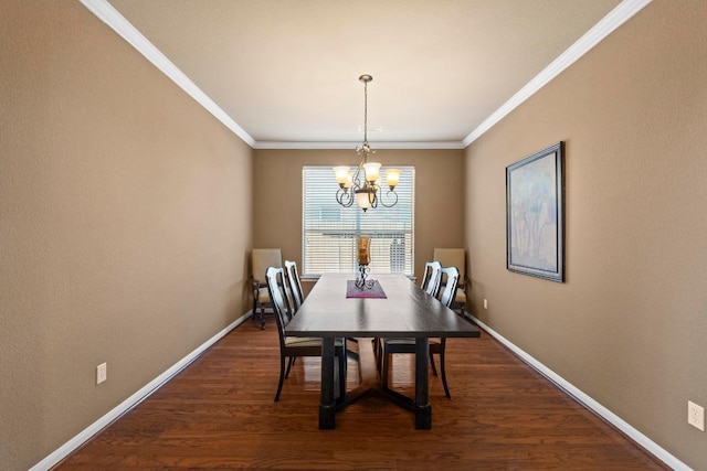 dining space featuring dark wood-style floors, baseboards, crown molding, and an inviting chandelier