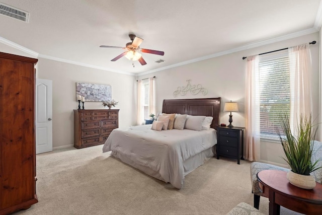 bedroom with ornamental molding, visible vents, and light carpet