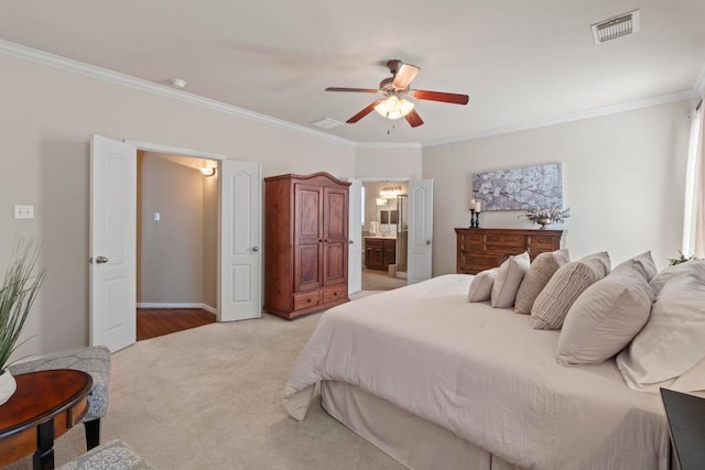 bedroom with crown molding, light colored carpet, visible vents, and ensuite bathroom