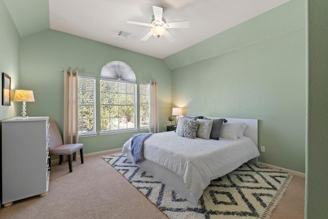 bedroom with visible vents, carpet flooring, baseboards, and lofted ceiling