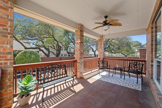 view of patio / terrace with fence and ceiling fan