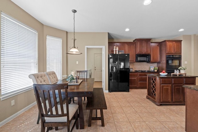 dining space featuring light tile patterned flooring, recessed lighting, and baseboards