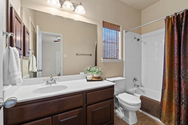 bathroom featuring tile patterned flooring, toilet, vanity, and shower / bath combo with shower curtain