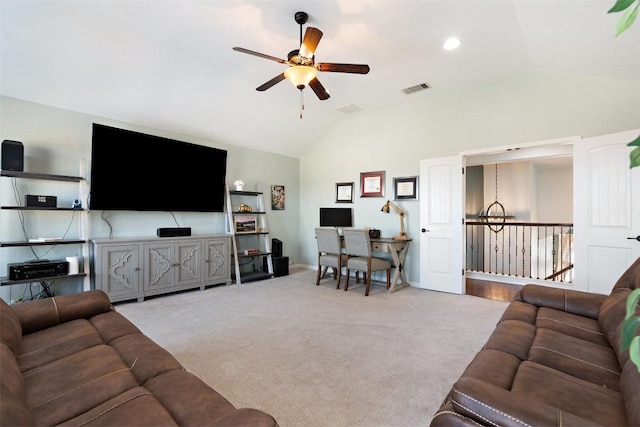 carpeted living room with visible vents, baseboards, a ceiling fan, and vaulted ceiling