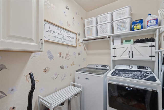 laundry room with washer and dryer and cabinet space