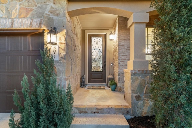 property entrance featuring brick siding and stone siding