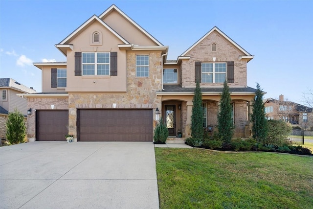 traditional-style home with a front yard, an attached garage, concrete driveway, stone siding, and brick siding