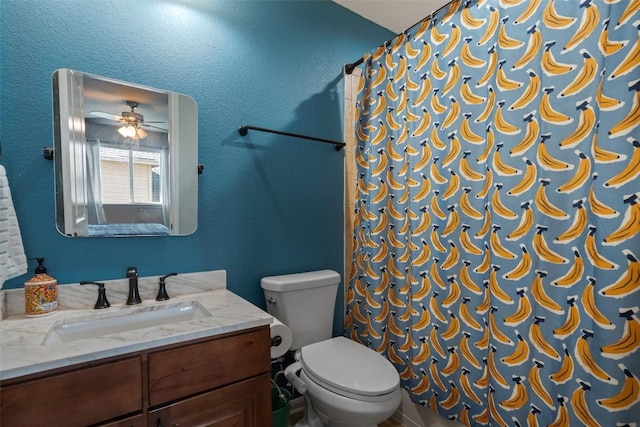 full bath with a shower with shower curtain, toilet, vanity, and a textured wall