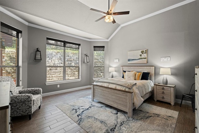 bedroom featuring ornamental molding, wood finished floors, baseboards, and vaulted ceiling