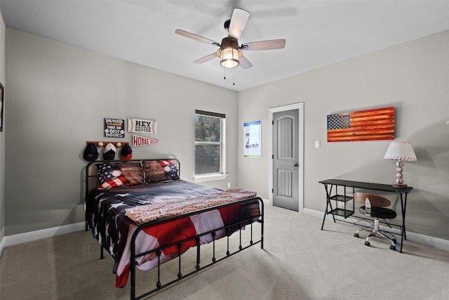 carpeted bedroom with baseboards and ceiling fan