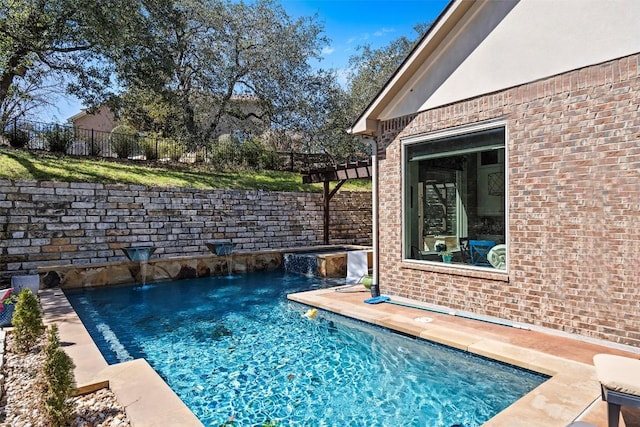 view of swimming pool featuring a fenced in pool, a pergola, and fence