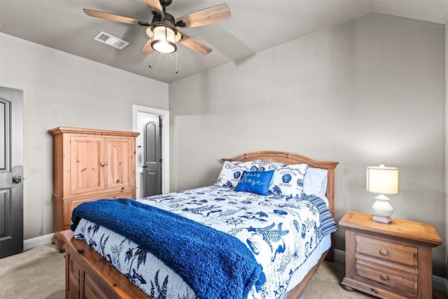 carpeted bedroom with lofted ceiling, baseboards, visible vents, and ceiling fan