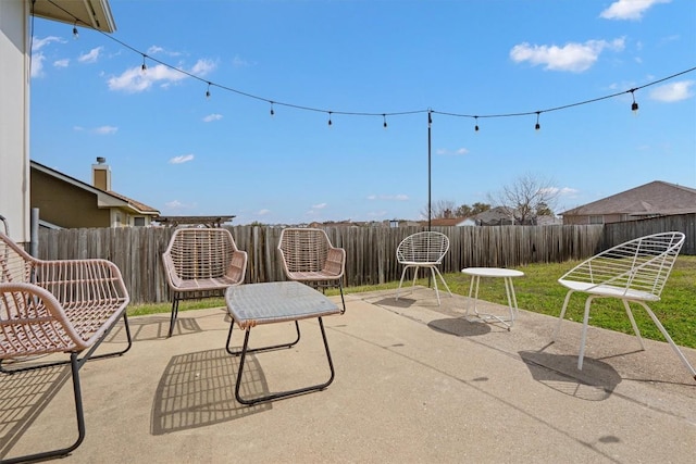 view of patio featuring a fenced backyard