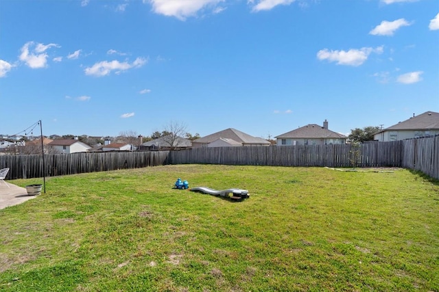 view of yard with a fenced backyard