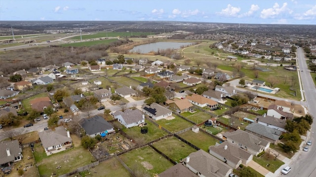 aerial view with a residential view and a water view