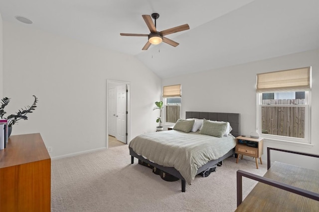 bedroom with light carpet, baseboards, lofted ceiling, and a ceiling fan