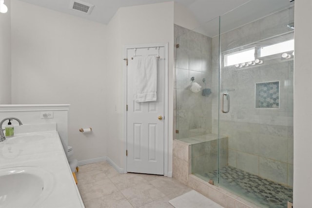 bathroom with a sink, visible vents, toilet, and a shower stall