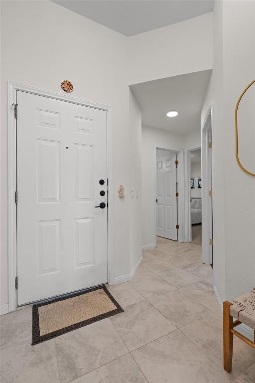 entrance foyer featuring baseboards