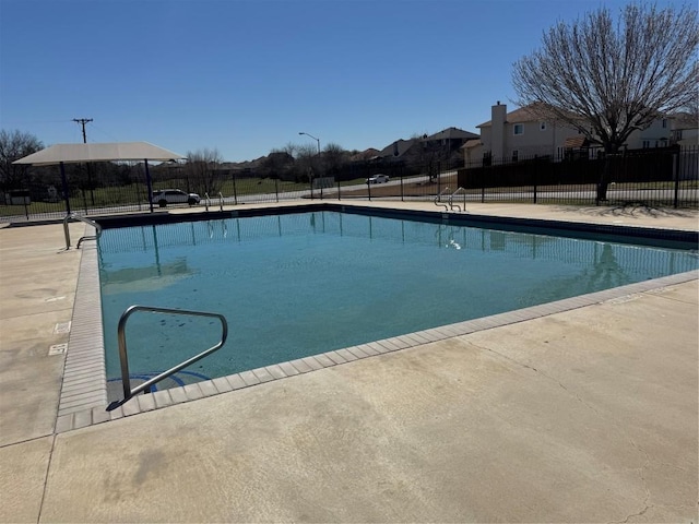 community pool featuring fence