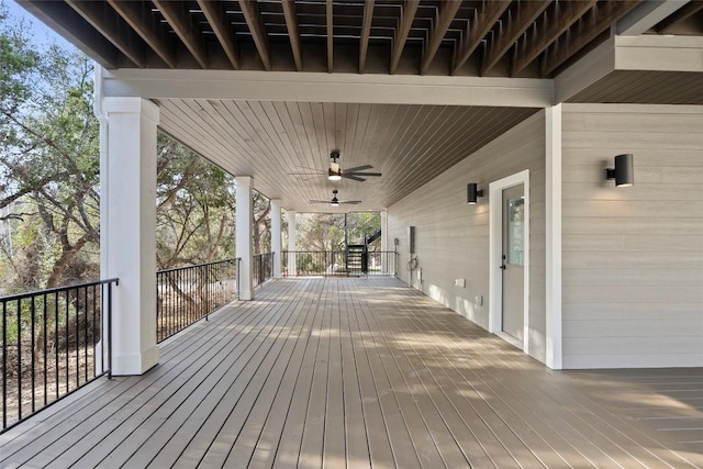 wooden deck featuring ceiling fan