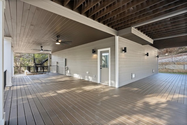 wooden deck with a ceiling fan