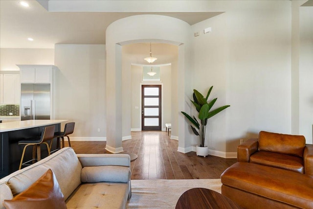 foyer entrance featuring recessed lighting, baseboards, and hardwood / wood-style floors