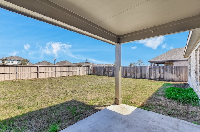 view of yard featuring a fenced backyard and a patio