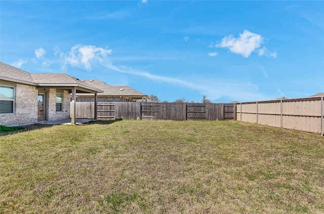 view of yard featuring a fenced backyard