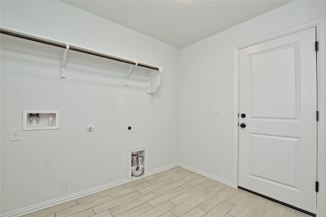 washroom featuring baseboards, laundry area, hookup for a washing machine, light wood-style floors, and electric dryer hookup