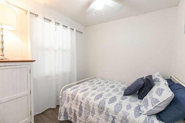 bedroom with a ceiling fan and wood finished floors