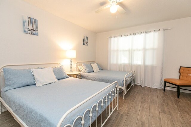 bedroom featuring a ceiling fan and wood finished floors