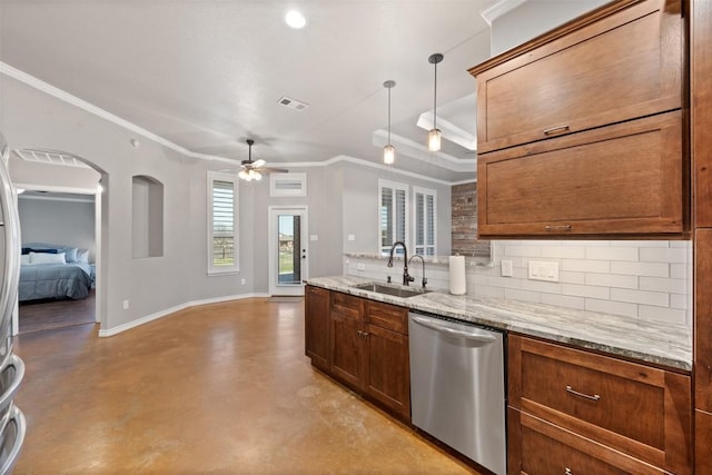 kitchen featuring baseboards, visible vents, a sink, dishwasher, and tasteful backsplash