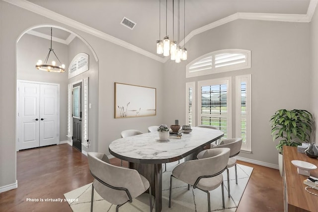 dining space with visible vents, high vaulted ceiling, crown molding, and an inviting chandelier