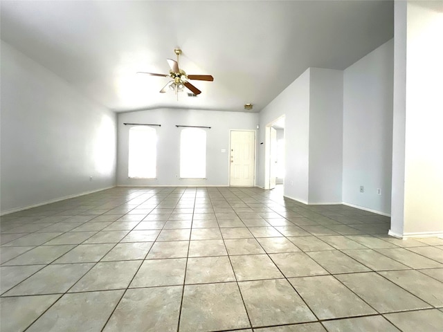 unfurnished living room featuring light tile patterned flooring, baseboards, and ceiling fan