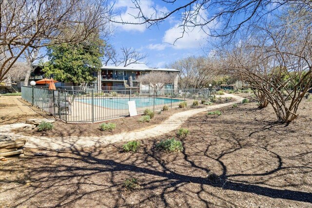 pool featuring a patio area and fence