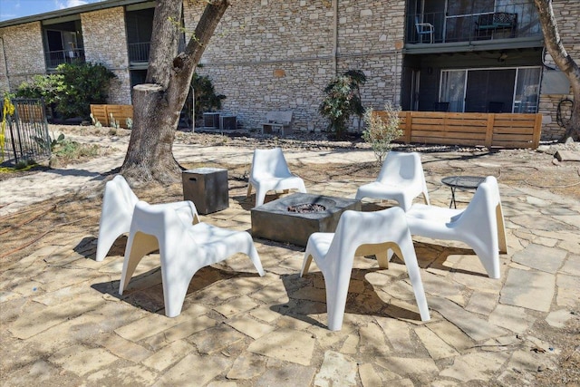 view of patio / terrace with a fire pit