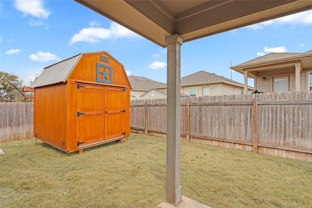 view of shed with a fenced backyard