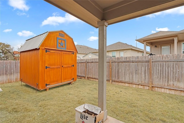 view of shed with a fenced backyard