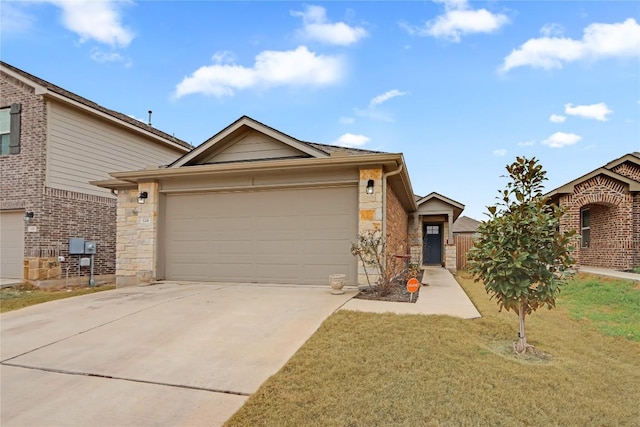 view of front of property with stone siding, an attached garage, concrete driveway, and a front yard