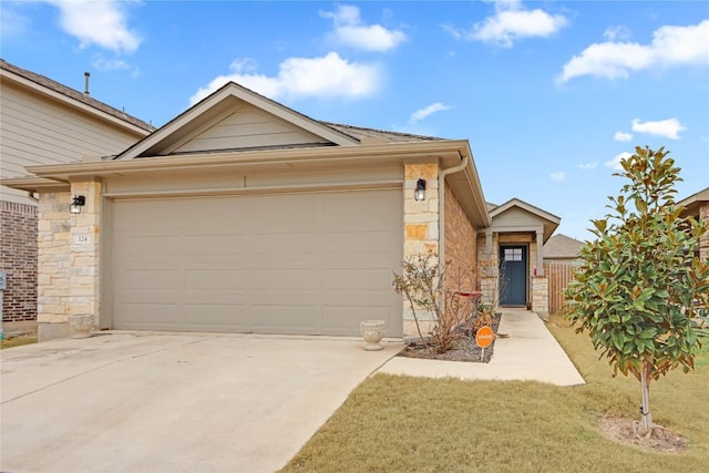 ranch-style house with concrete driveway, an attached garage, and stone siding