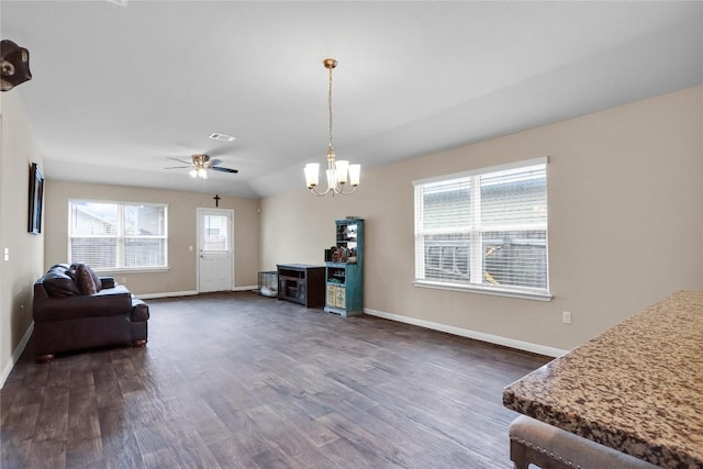 living room with a wealth of natural light, baseboards, and dark wood finished floors